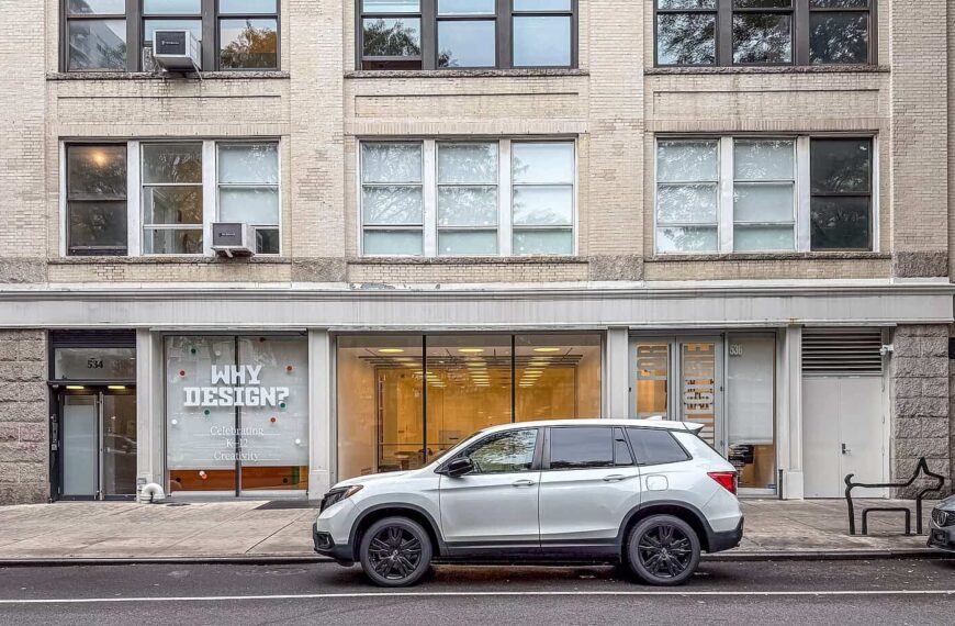 The storefront of the Center for Architecture, its window lettered “Why Design?”, with a car parked at the kerb