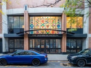The Ukrainian Museum, its upper window filled with a grid of brightly coloured geometric panels