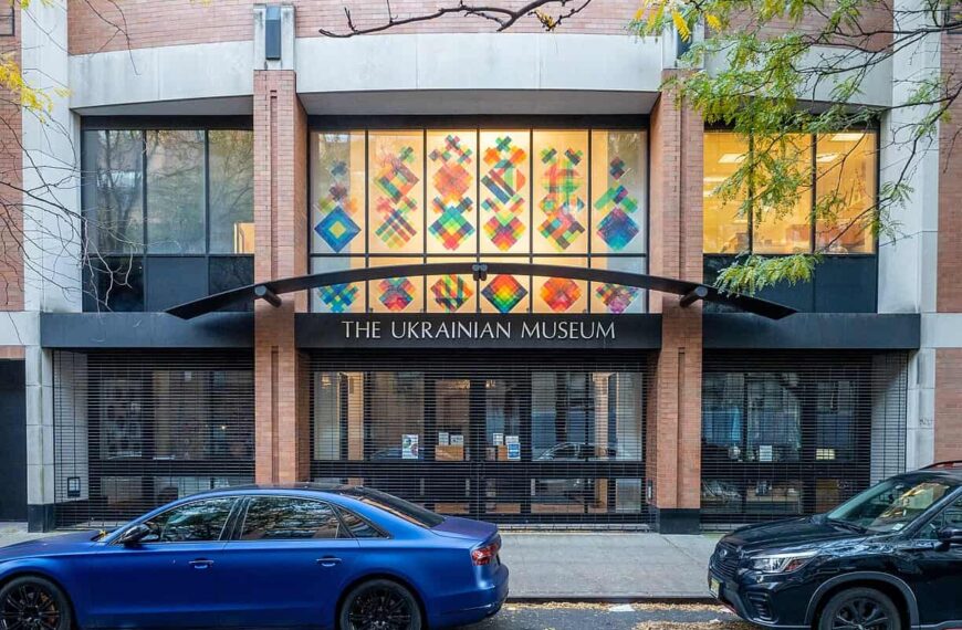 The Ukrainian Museum, its upper window filled with a grid of brightly coloured geometric panels