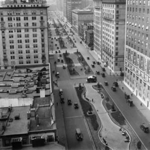 A black and white aerial view of New York City streets and parks.