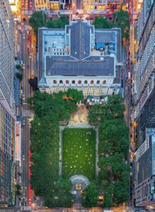 Aerial view of Bryant Park surrounded by skyscrapers in New York City.