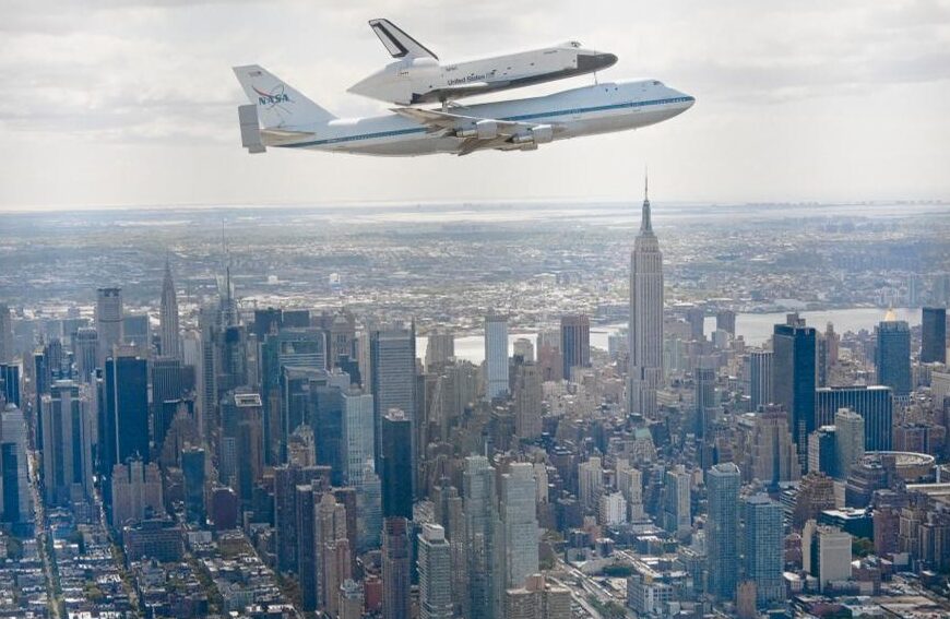 The flight of the space shuttle Enterprise over Manhattan on a Boeing 747