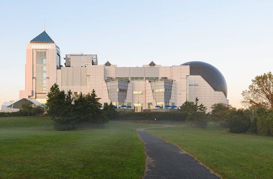 The Liberty Science Center at dawn, its planetarium dome rising above a lawn in Jersey City